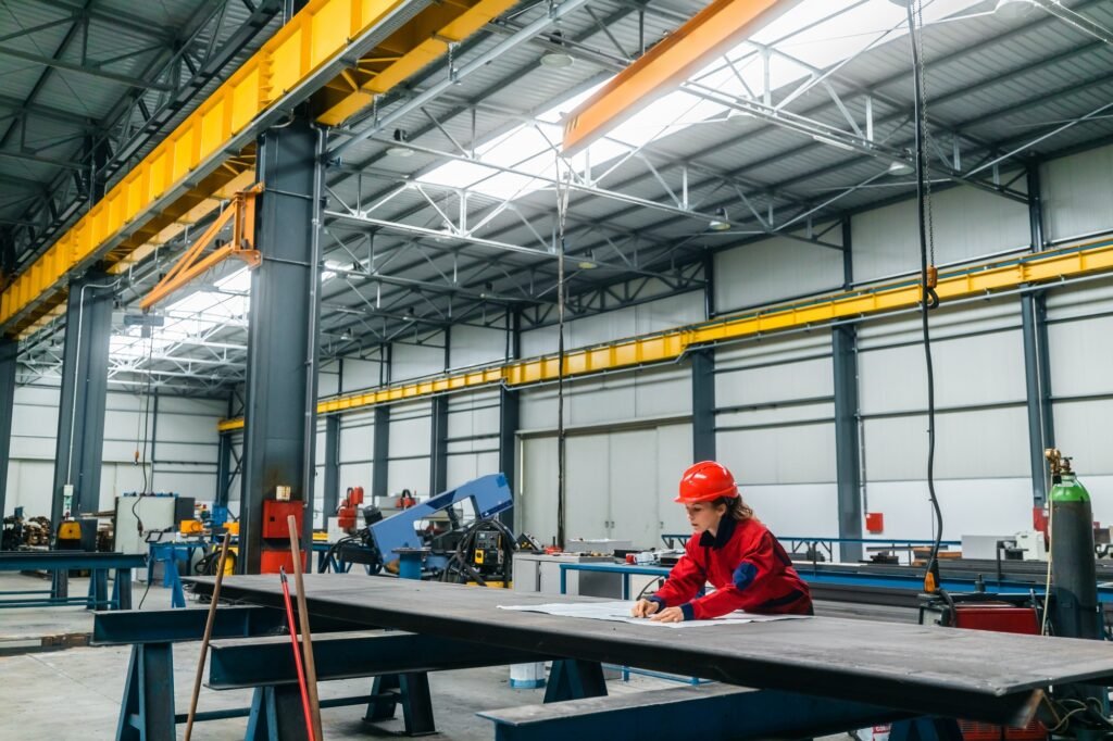 Engineer working at industrial building.